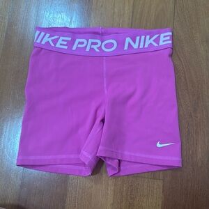 Pink Nike Pro shorts